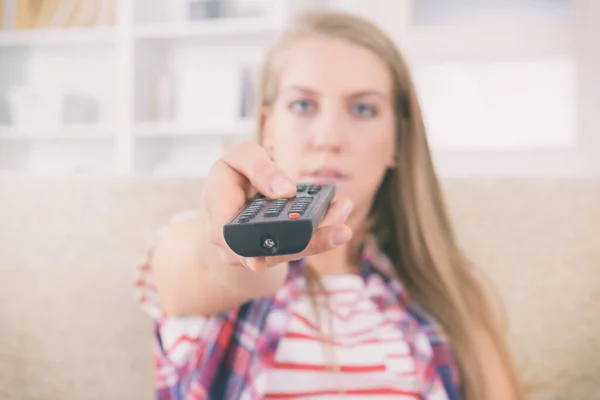 Beautiful Young Woman Holding Remote Control Changing Channels — Stock Photo, Image