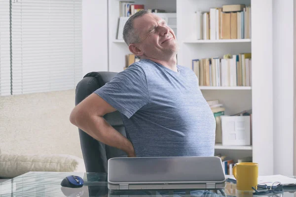 Hombre Oficina Del Hogar Que Sufre Dolor Espalda Baja Sentado —  Fotos de Stock