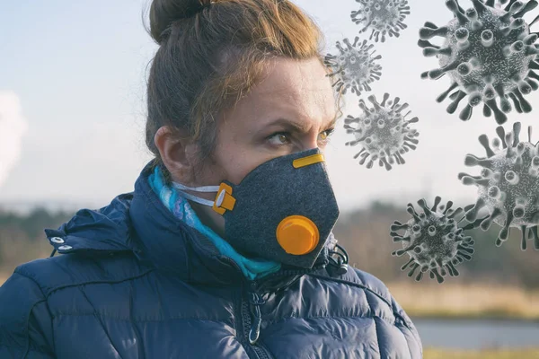 Woman wearing a real anti-pollution and anti-viruses face mask outside. SARS COVID-19 pandemic concept