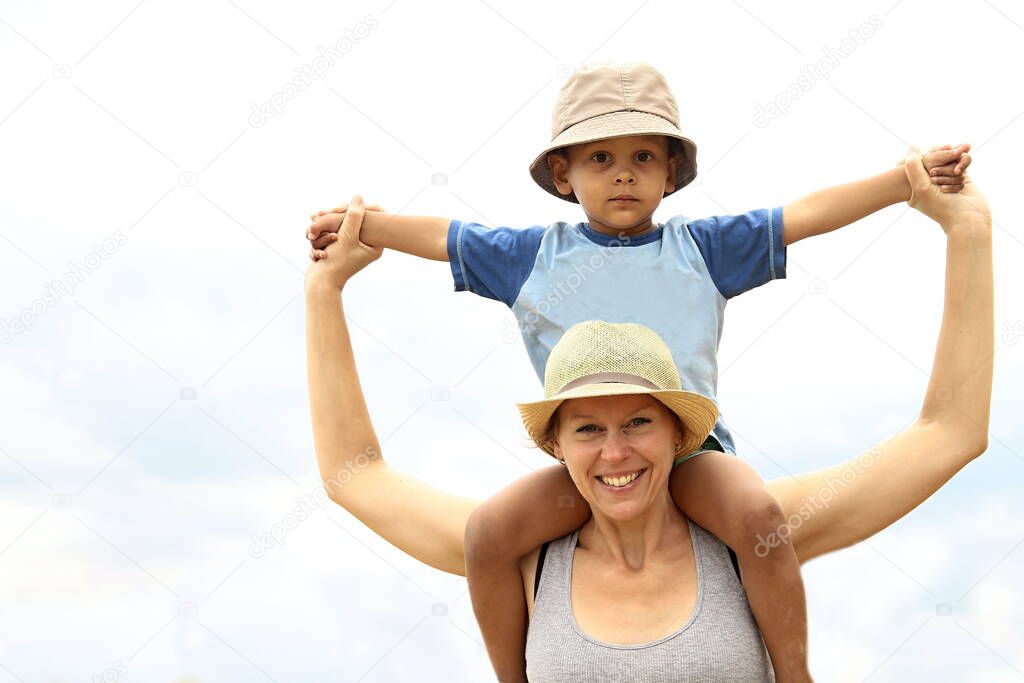 mother giving child piggyback ride
