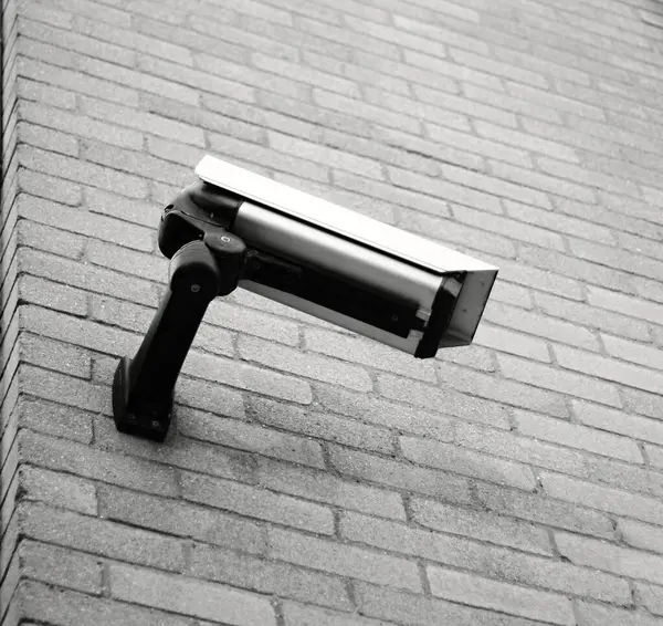 security camera stand overlooking the town
