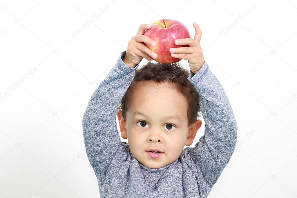 a little boy with apple