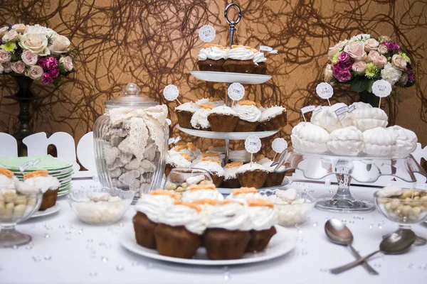 Candy bar with cupcakes, marshmallows and cookies