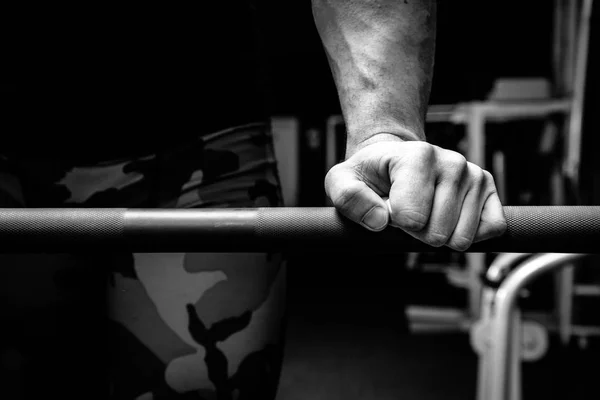 Male athlete in the gym doing exercises