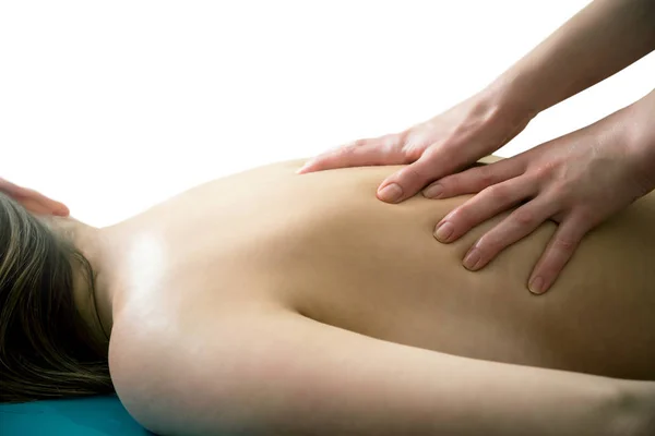 Massagem das costas em um fundo branco — Fotografia de Stock