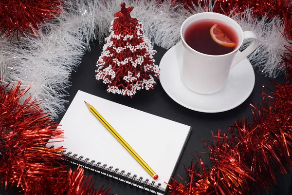 Cup of red tea with lemon slice, notebook with pencil, red and w — Stock Photo, Image