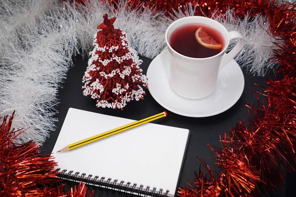 Cup of red tea with lemon slice, notebook with pencil, red and w — Stock Photo, Image