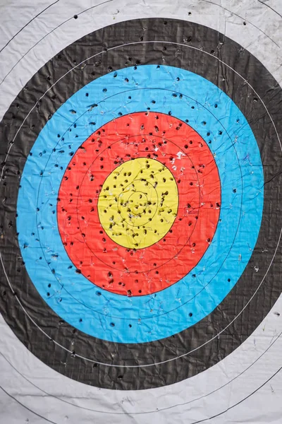 Used and drilled archery target on archery range
