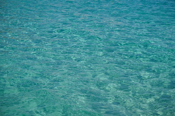 Transparent tirquoise sea water with little waves — Stock Photo, Image