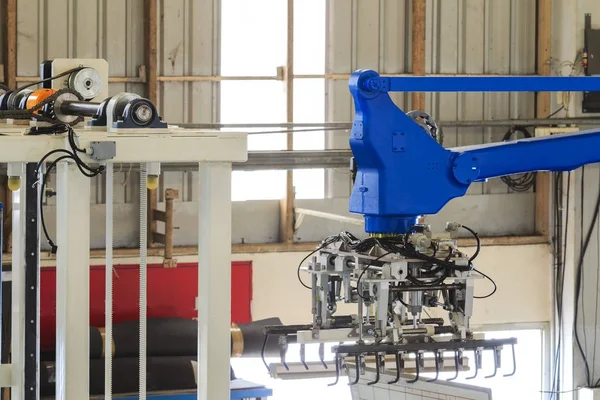 Industry 4.0 concept . Industrial picking robot in smart warehouse system of manufacture factory