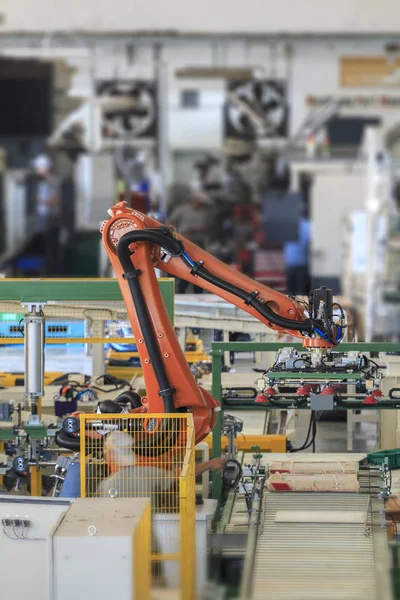Factory 4.0 concept. Industrial picking robot in smart warehouse system of manufacture factory