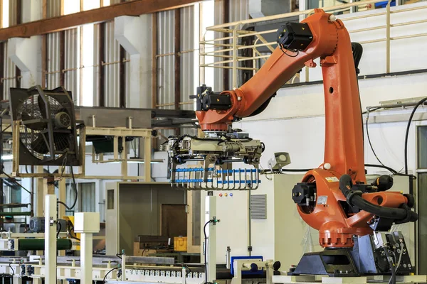 Industry 4.0 concept . Industrial picking robot in smart warehouse system of manufacture factory