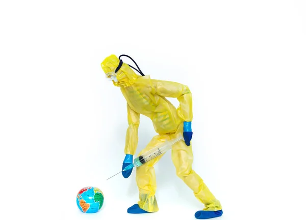 Toy man in hazmat suit inject medicine vaccine to earth, concept of vaccination and treatment viral pandemic of all mankind — Stock Photo, Image