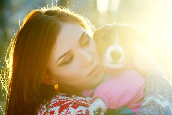 Jack Russell Terrier dog with owner woman in the winter outdoors. — Stock Photo, Image