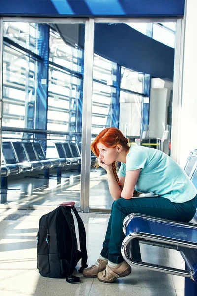 Woman at the airport. redhead girl with tablet computer. business and travel Royalty Free Stock Photos