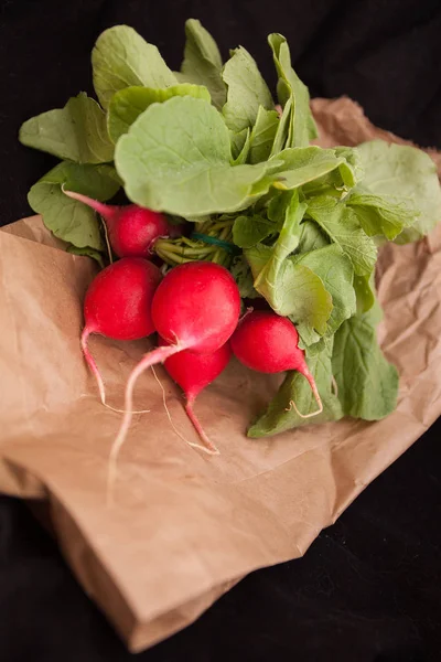 Raw radishes with leaves.