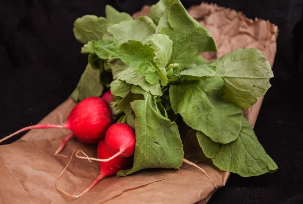 Raw radishes with leaves.