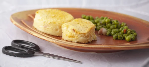 Two Potato Patties Pea Bacon Garnish Fish Dish White Background — Stock Photo, Image