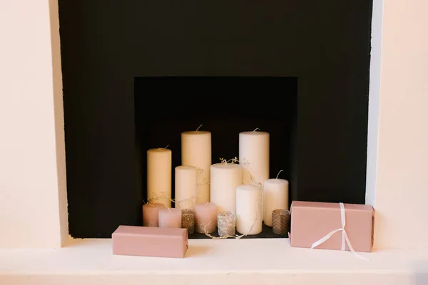 Christmas decor, white candles on the fireplace — 스톡 사진