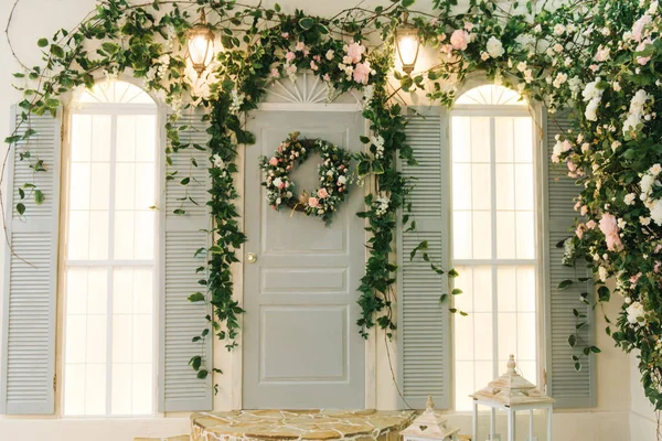 decorated with flowers house facade and door