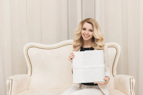 Beautiful Young Blonde Girl Holding White Photo Book Light Background — Stock Photo, Image