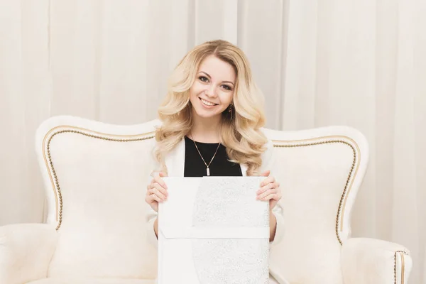 Beautiful Young Blonde Girl Holding White Photo Book Light Background — 스톡 사진