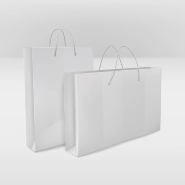 İki alışveriş torbaları beyaz bir arka plan üzerinde beyaz. Gerçekçi kağıt torbalar. Eps10 vektör.