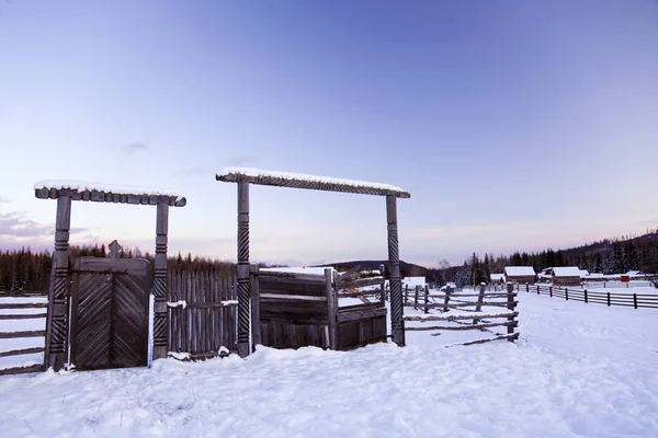 Big wooden gate. Carved gate.