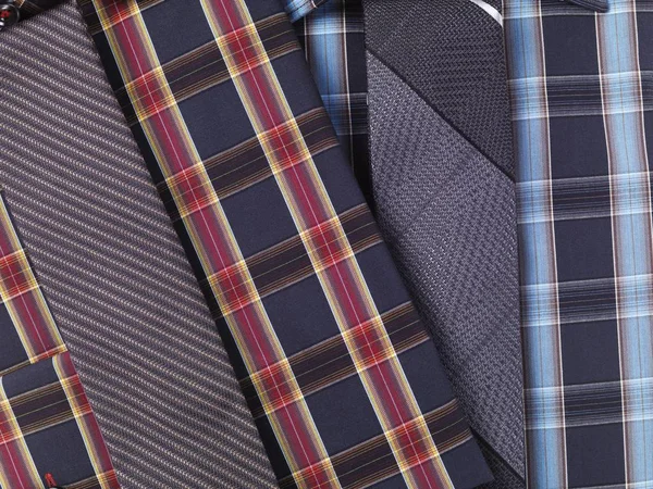 Men red and blue tartan pattern collared shirts with slim ties, closeup