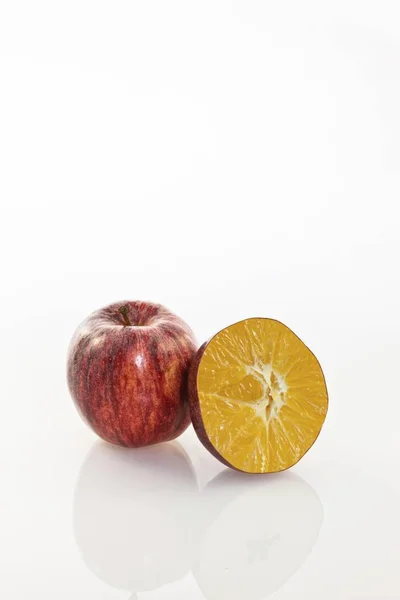 Symbolic image, genetically modified apple, apple and orange cloned together