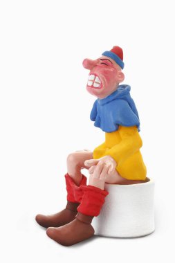 man figurine sitting on toilet, cartoon character clipart