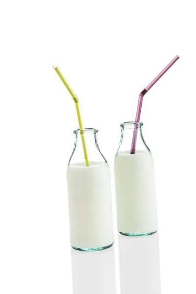 Молоко Бутылках Соломинками Студия Выстрела — стоковое фото