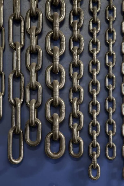 Chains, chain links hanging on wall