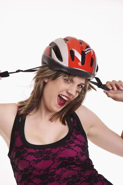 Young woman with a cycle helmet