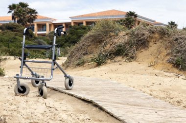 Walking frame left on the beach clipart