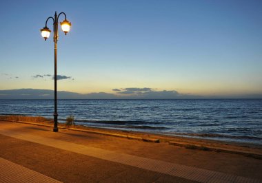 Seafront, double street light, sea, Greece, Europe clipart