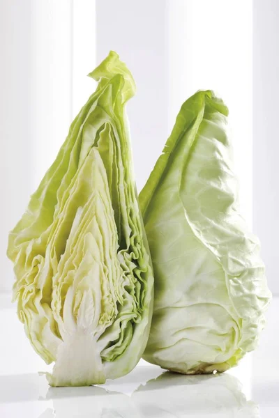 Green pointed cabbage isolated on white