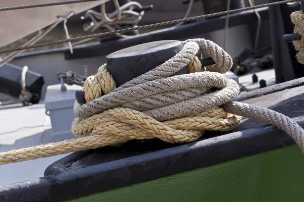 harbor rope knot and ship on background