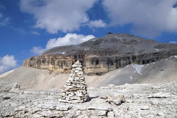 Stone markers, piles of stones, with Piz Boe peak on the Sella massif, Passo Sella, province of Bolzano-Bozen, Italy, Europe