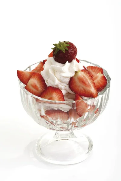 stock image Whipped cream and strawberries served in a parfait glass