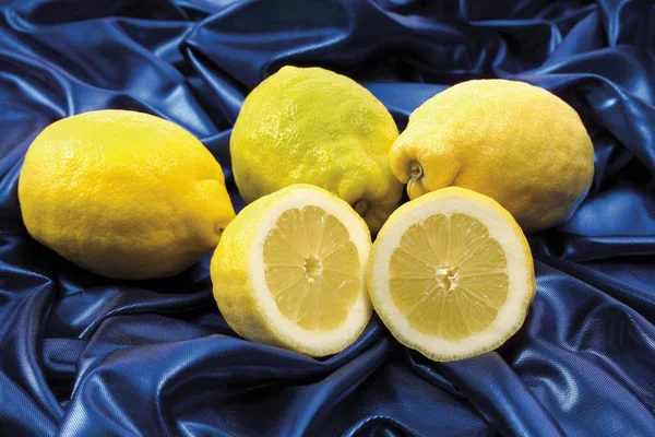 Yellow Lemons Blue Fabric — Stock Photo, Image