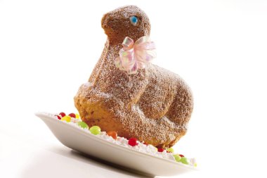 Easter lamb made of dough, sprinkled with icing sugar clipart