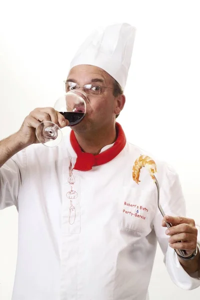 Chef Tasting Red Wine Holding King Prawn Fork — Stock Photo, Image
