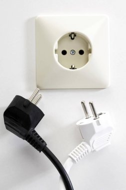 Electrical outlet and black and white plugs clipart