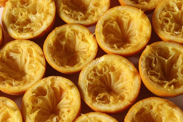 Pressed out and squeezed orange fruits