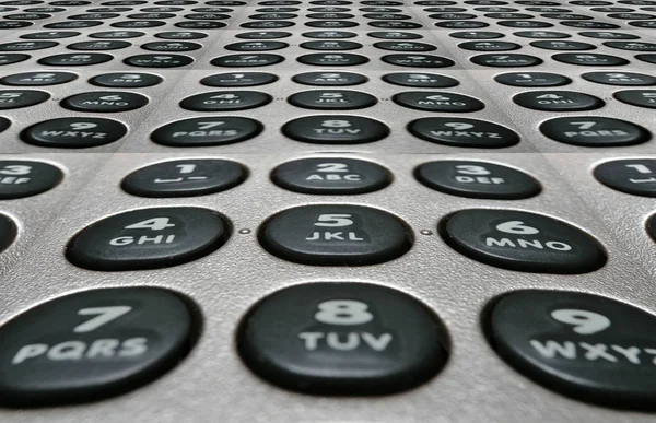 Telephone keyboard buttons with numbers and letters