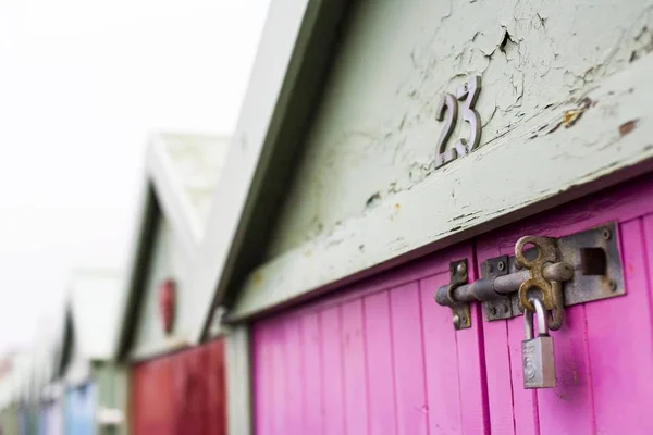 locked pink door of building house