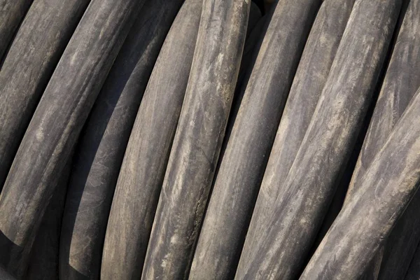 Rolled up black Rubber Tubing