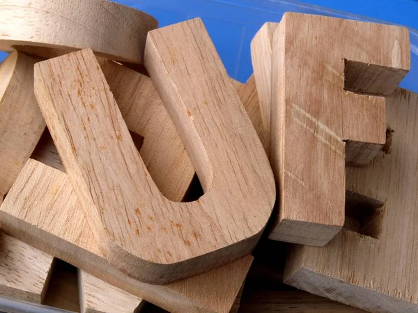 Gros Plan Des Lettres Bois Alphabet Sur Surface Bleue Symbolisme — Photo