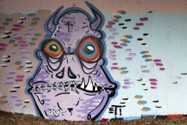 Monster with horns and mouth sewn shut, mural, street art, Dsseldorf, North Rhine-Westphalia, Germany, Europe  clipart